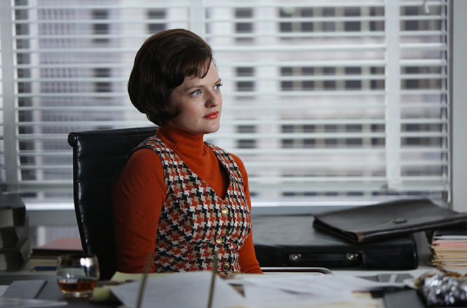 Peggy Olson in a houndstooth polyester jumper over a red sweater--1970s power clothes