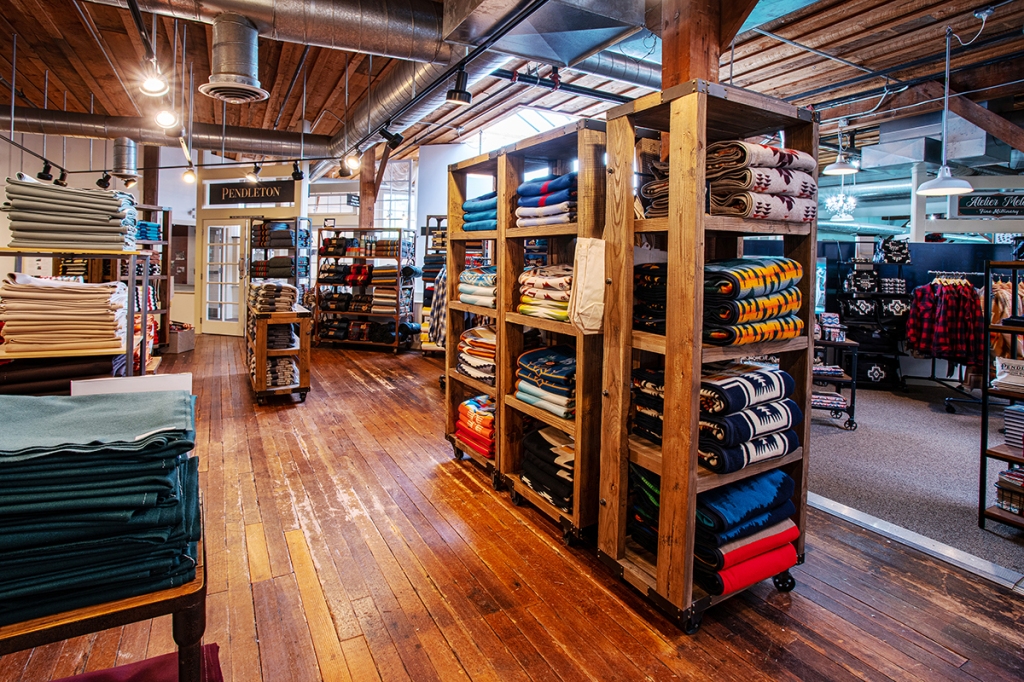 A shot of the store interior with wooden floors and lots of Pendleton goods on shelves